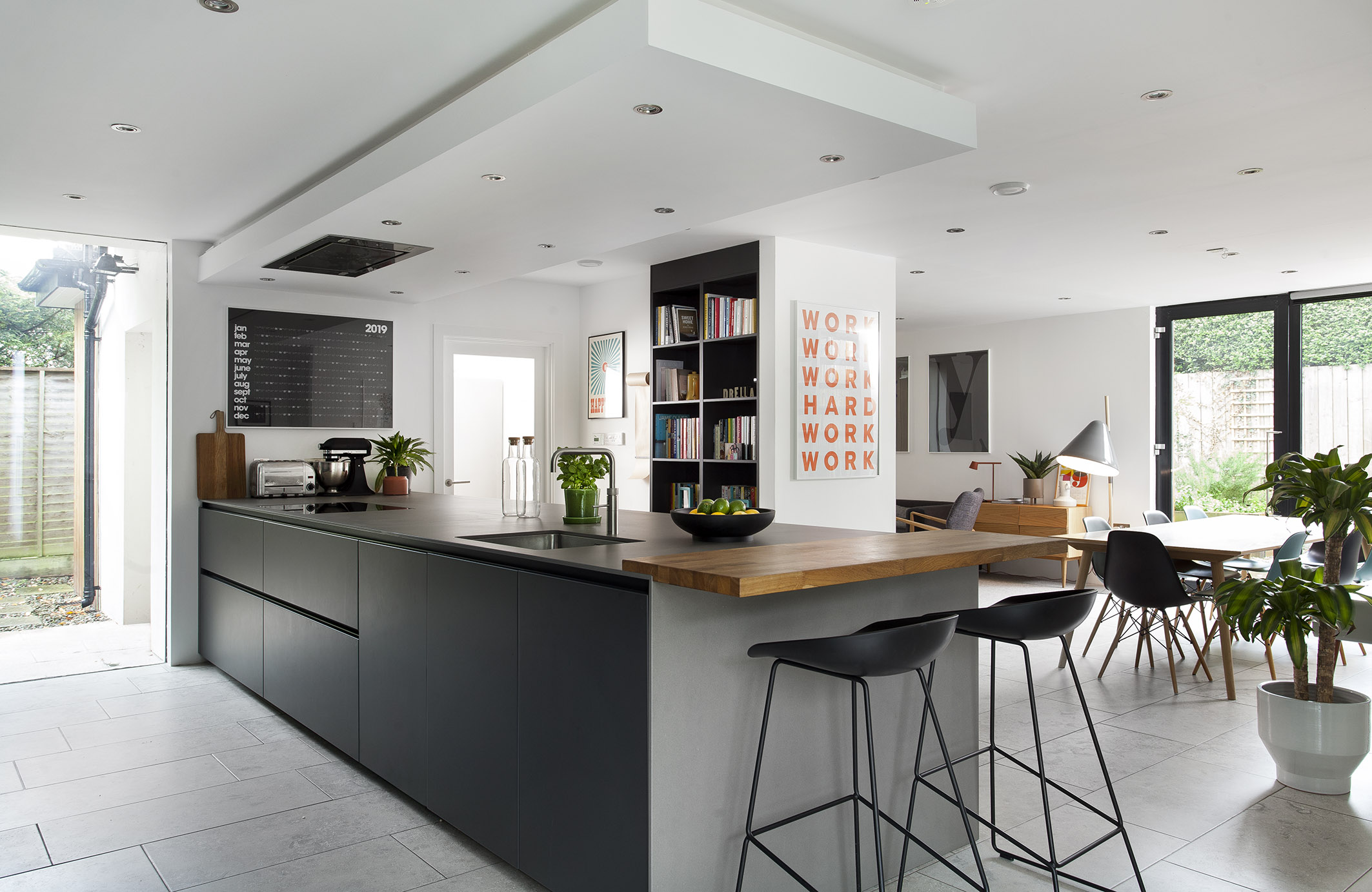 White hi gloss kitchen with coffee station and hidden utility
