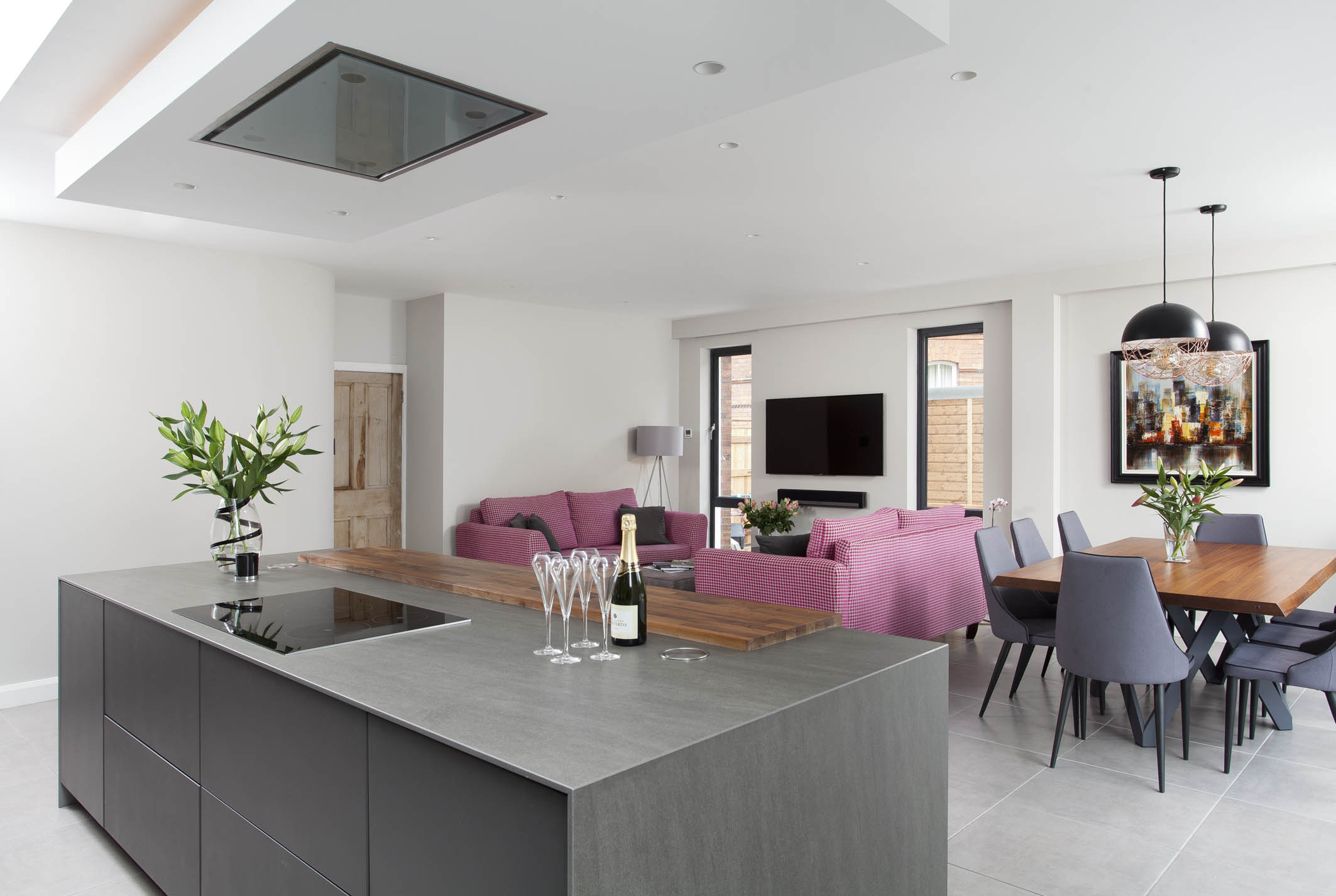 White hi gloss kitchen with coffee station and hidden utility