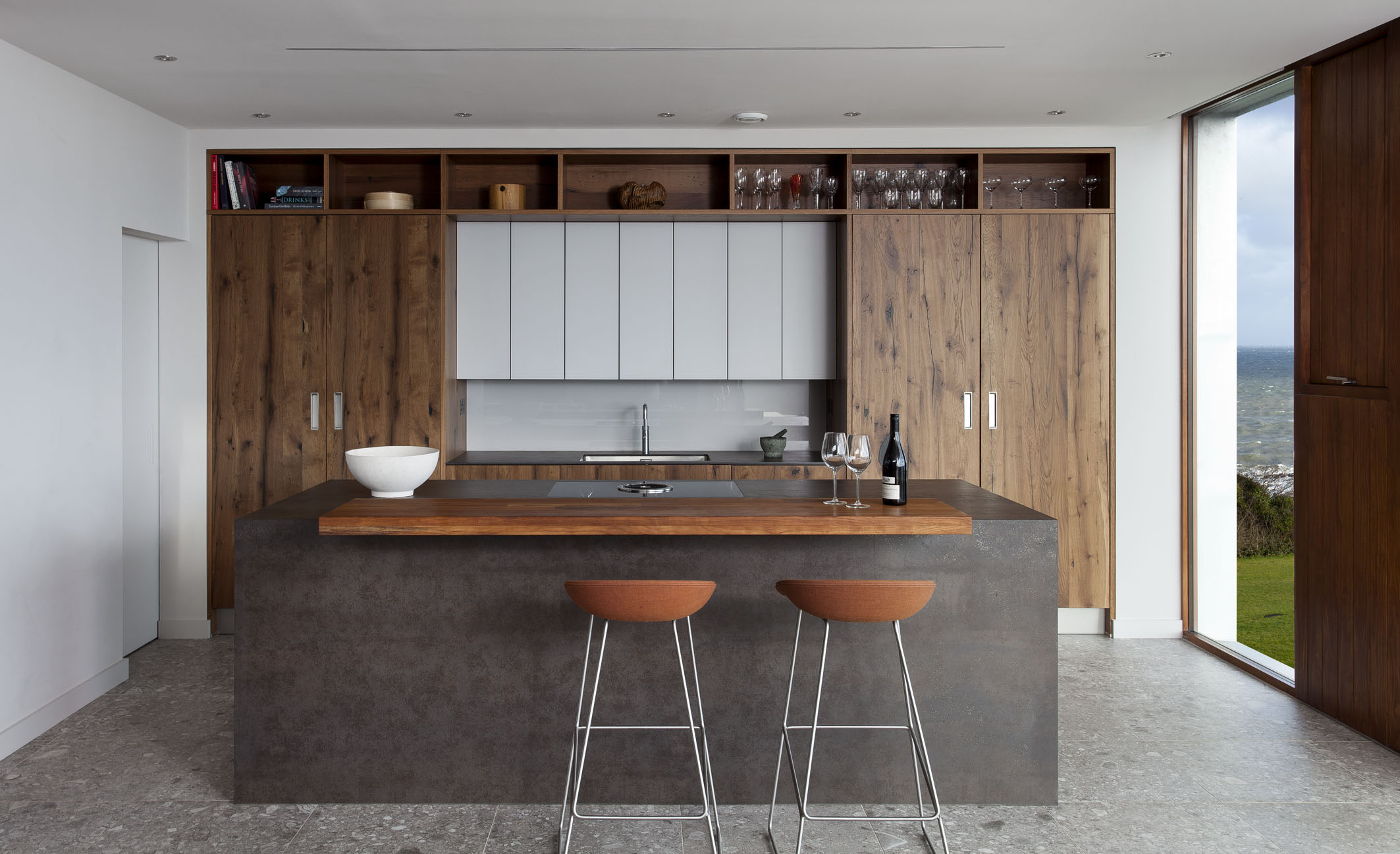 White hi gloss kitchen with coffee station and hidden utility