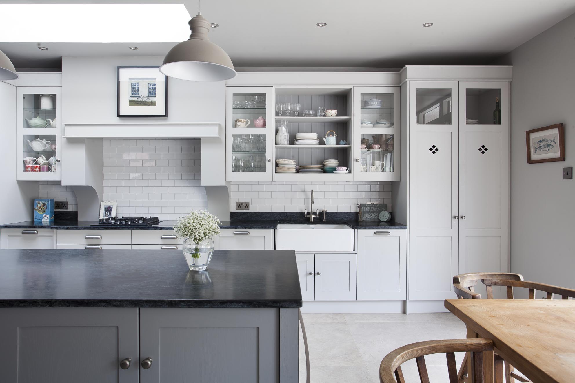 White hi gloss kitchen with coffee station and hidden utility