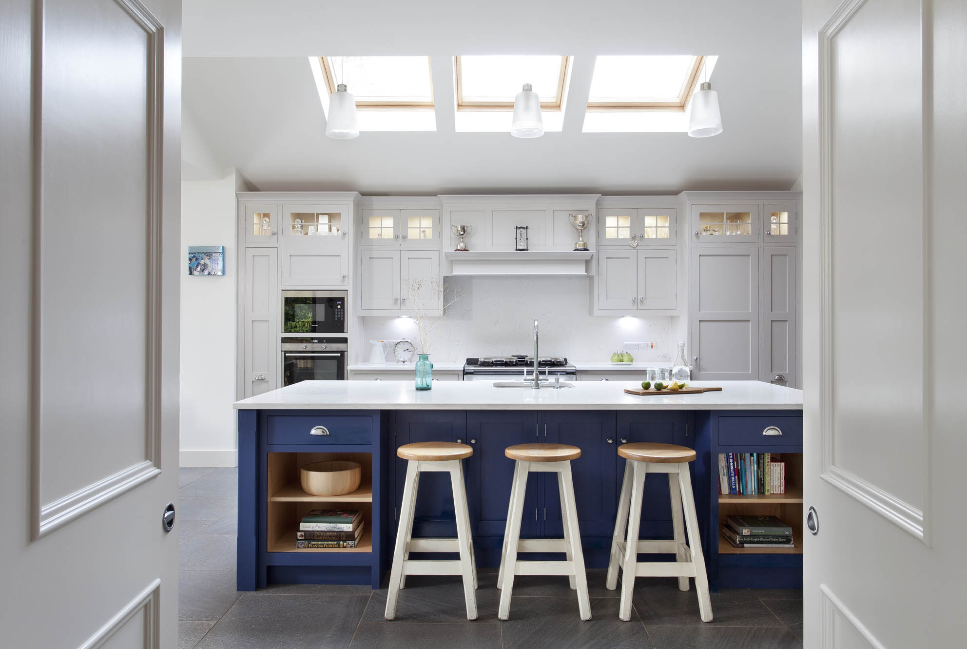 White hi gloss kitchen with coffee station and hidden utility