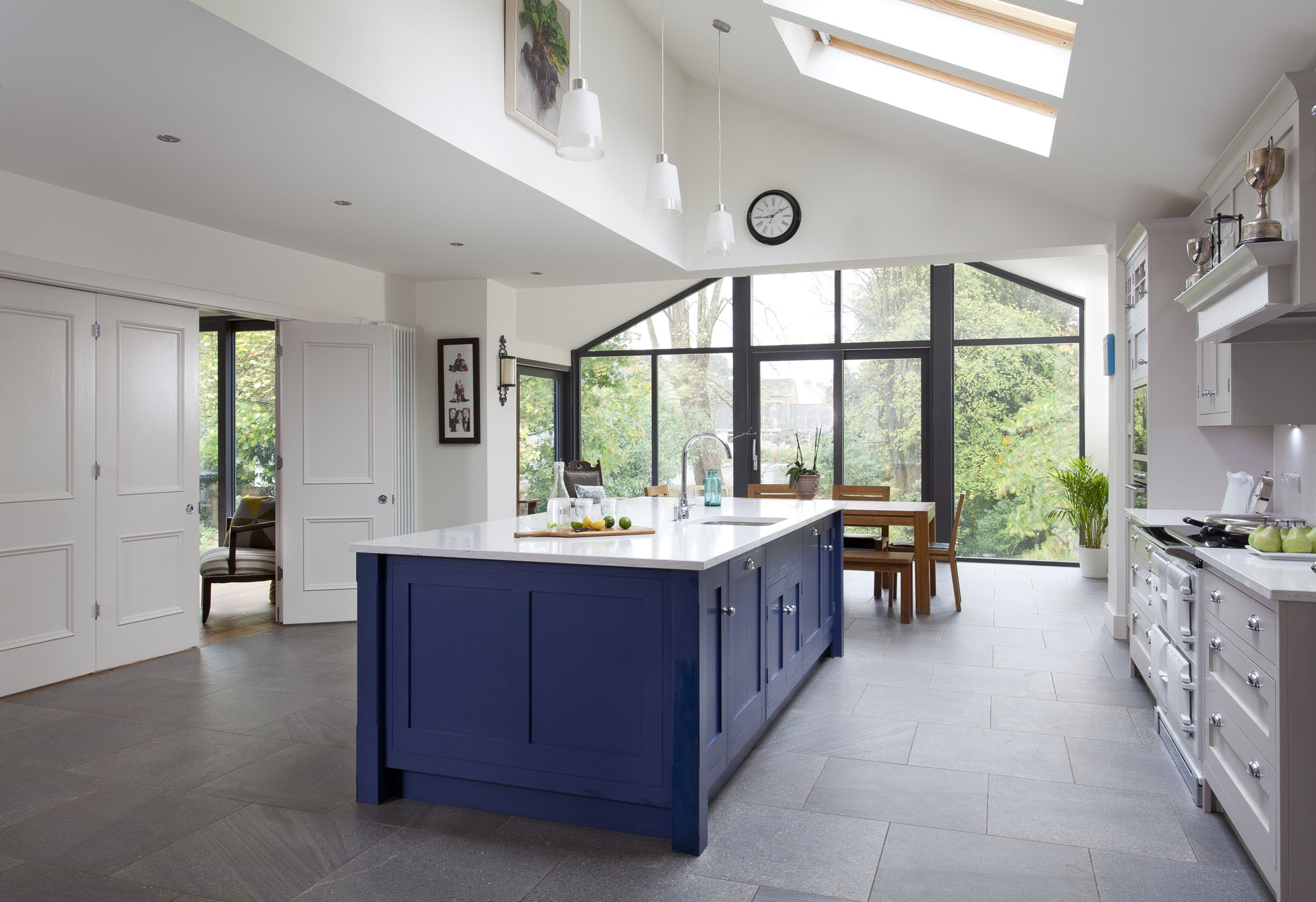 White hi gloss kitchen with coffee station and hidden utility