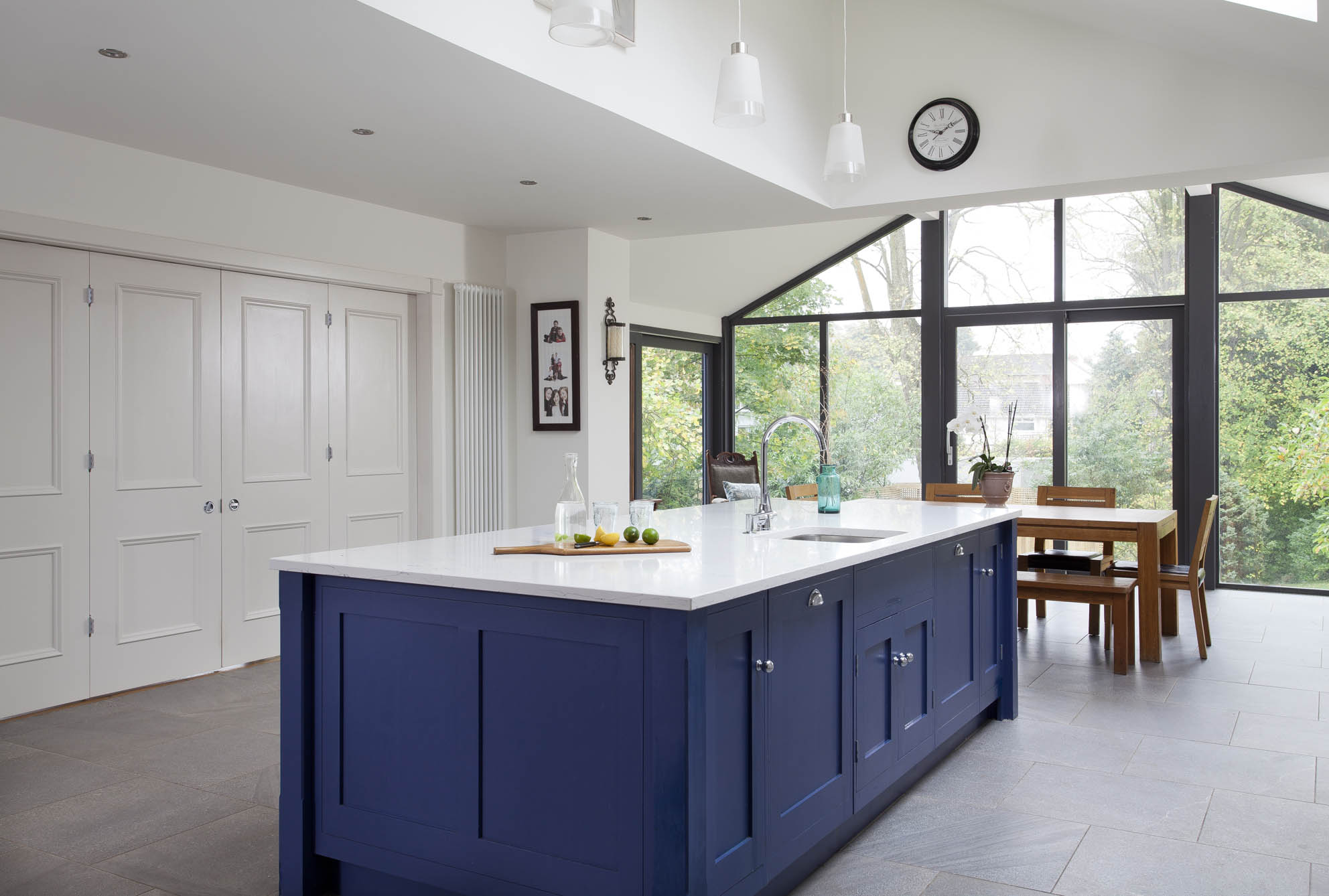 White hi gloss kitchen with coffee station and hidden utility
