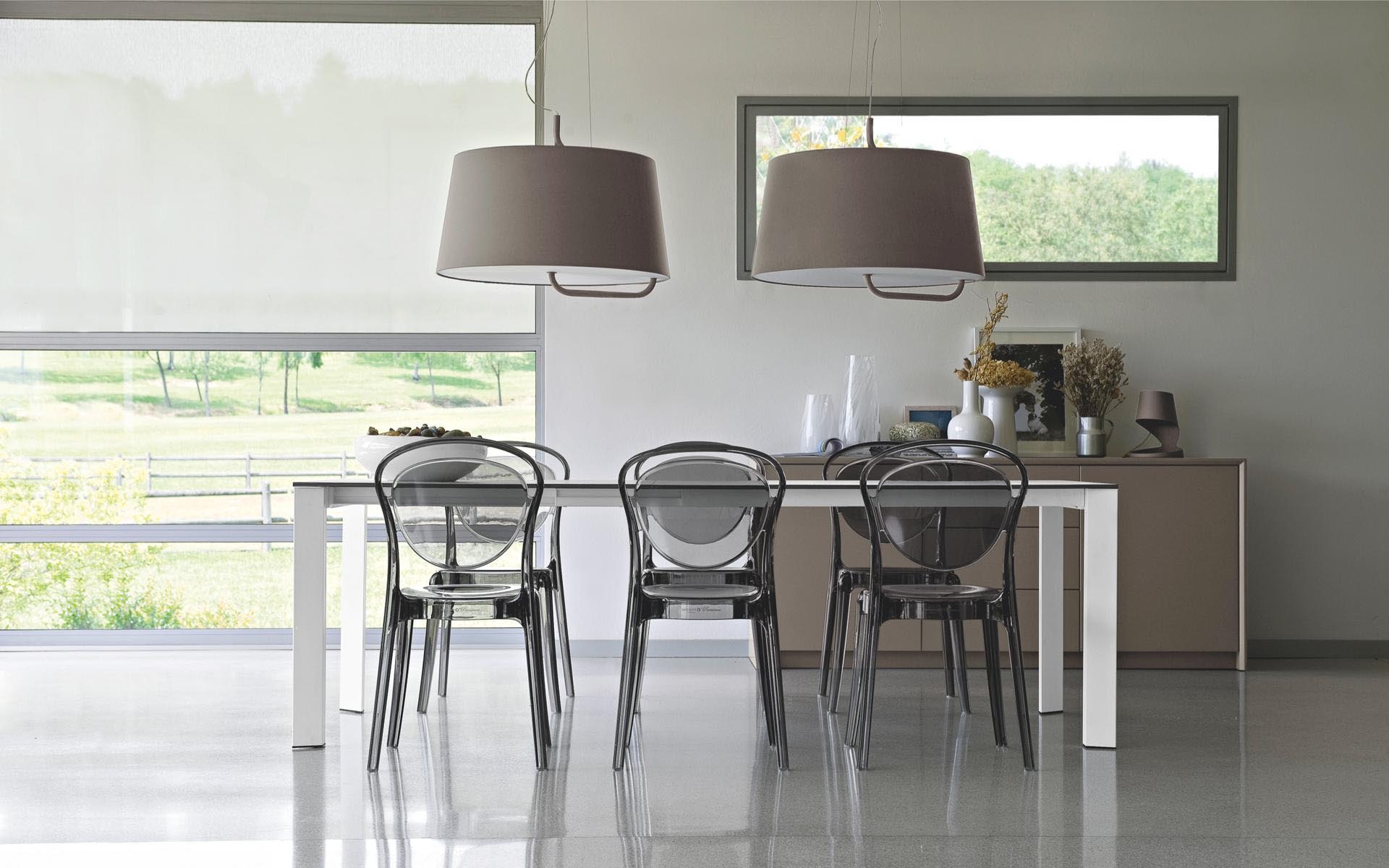 Calligaris lighting above dining table and chairs