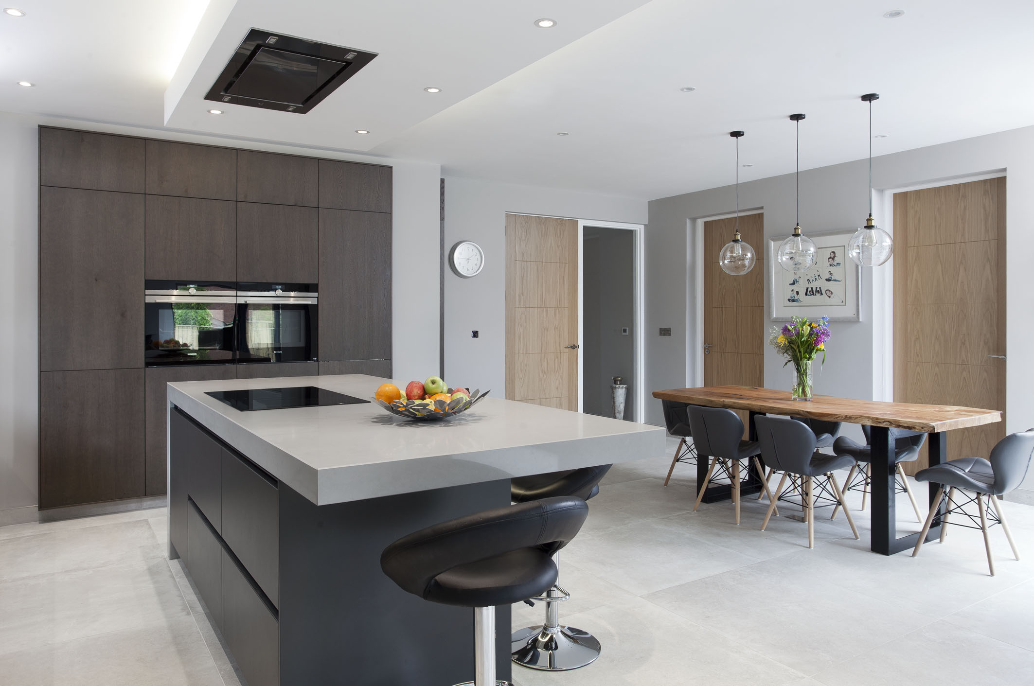 White hi gloss kitchen with coffee station and hidden utility