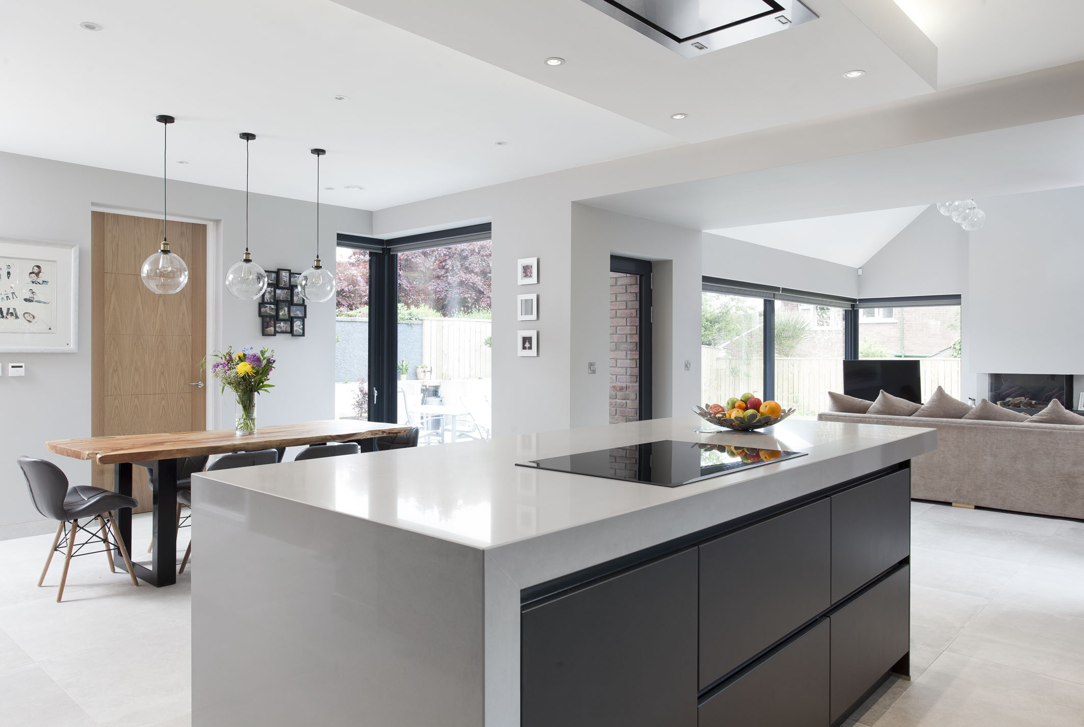 White hi gloss kitchen with coffee station and hidden utility
