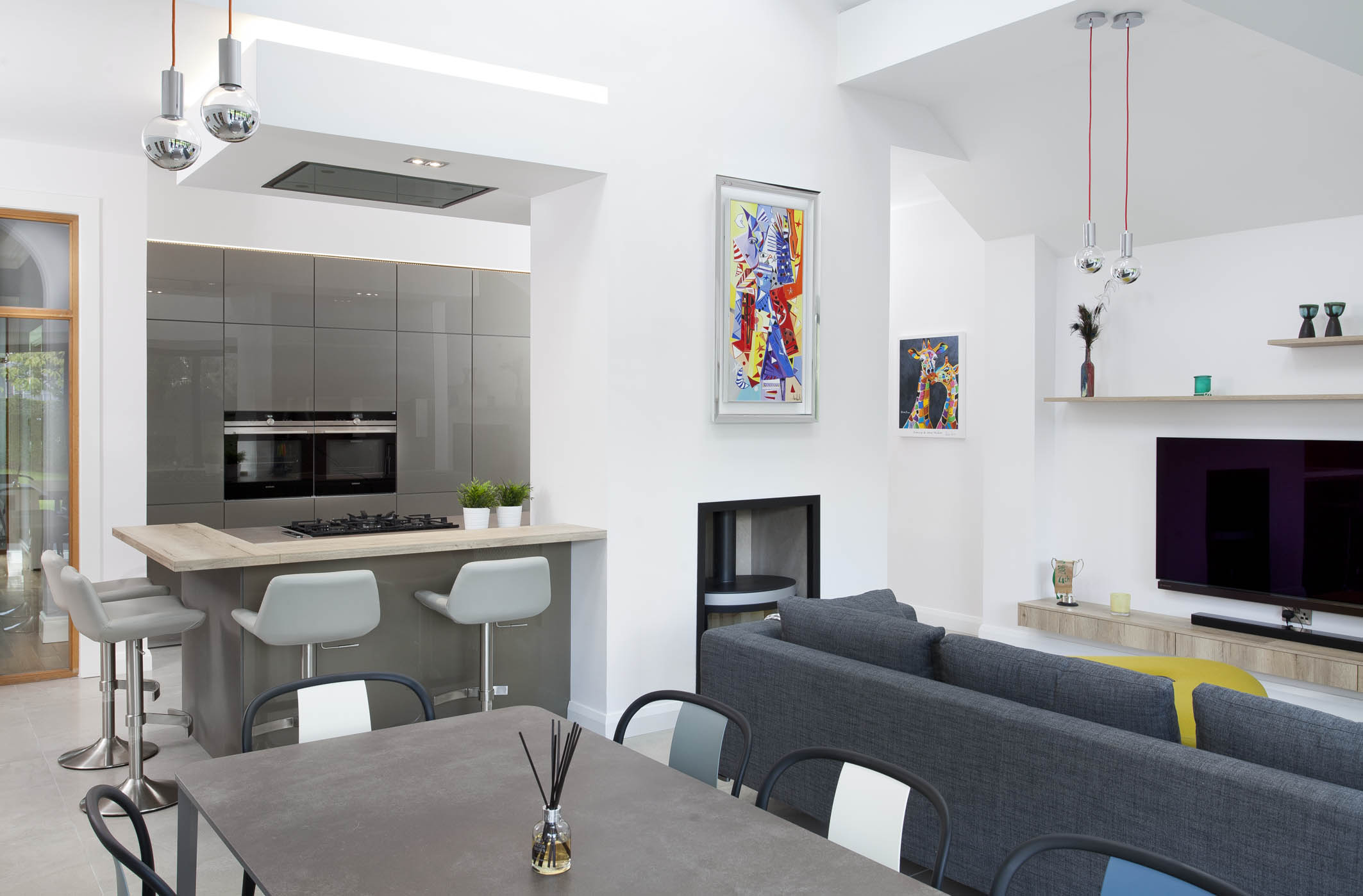 White hi gloss kitchen with coffee station and hidden utility