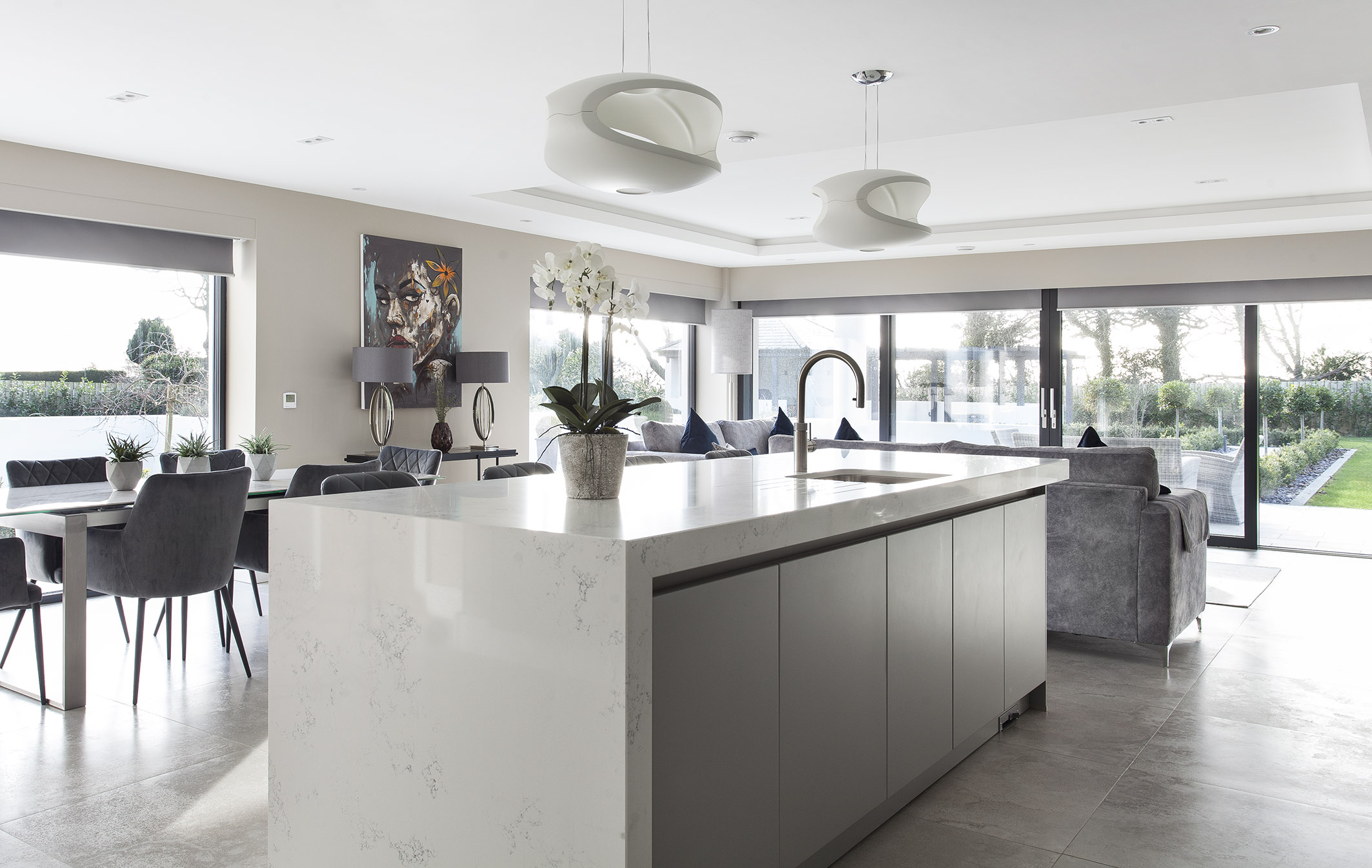 White hi gloss kitchen with coffee station and hidden utility