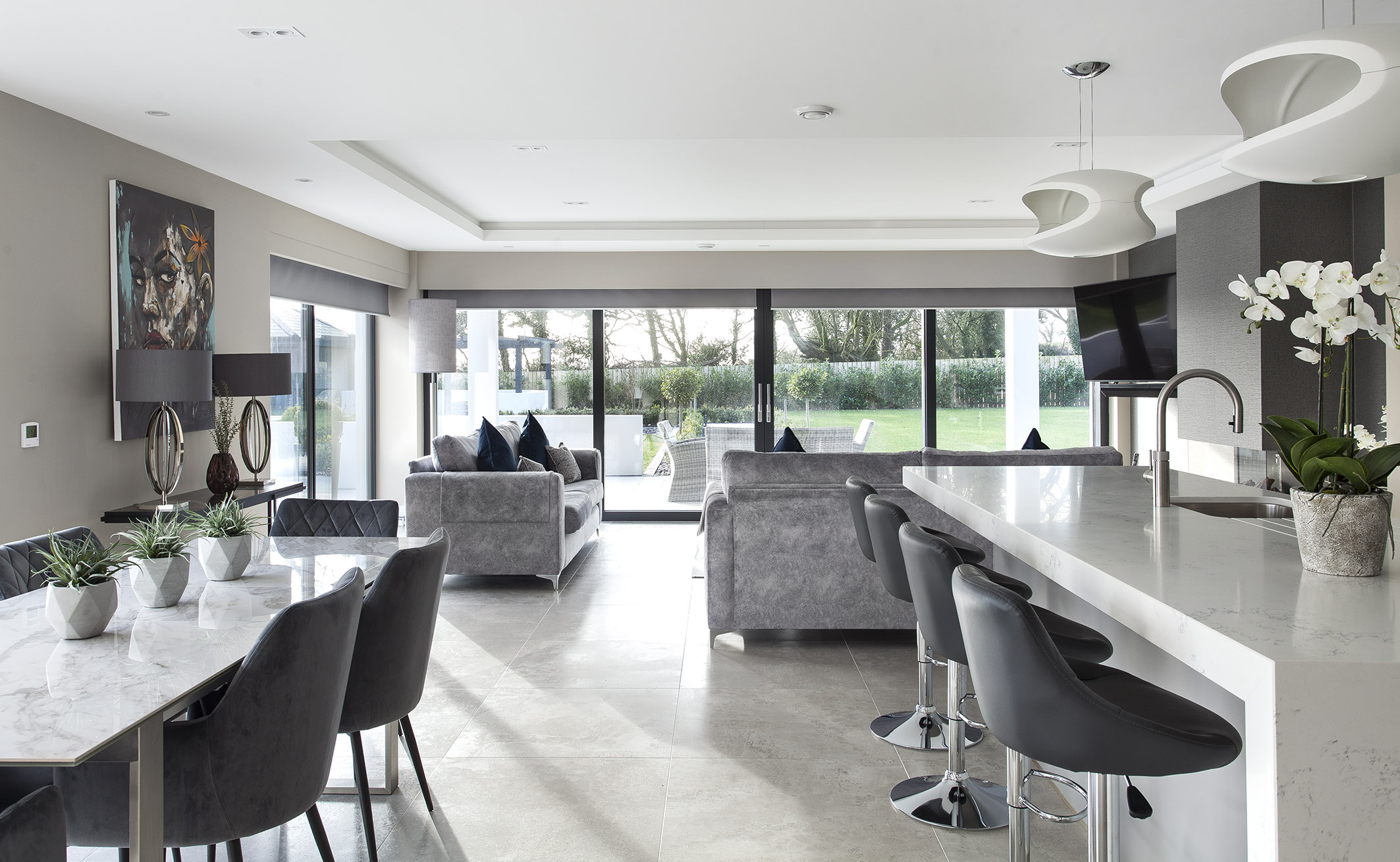 White hi gloss kitchen with coffee station and hidden utility