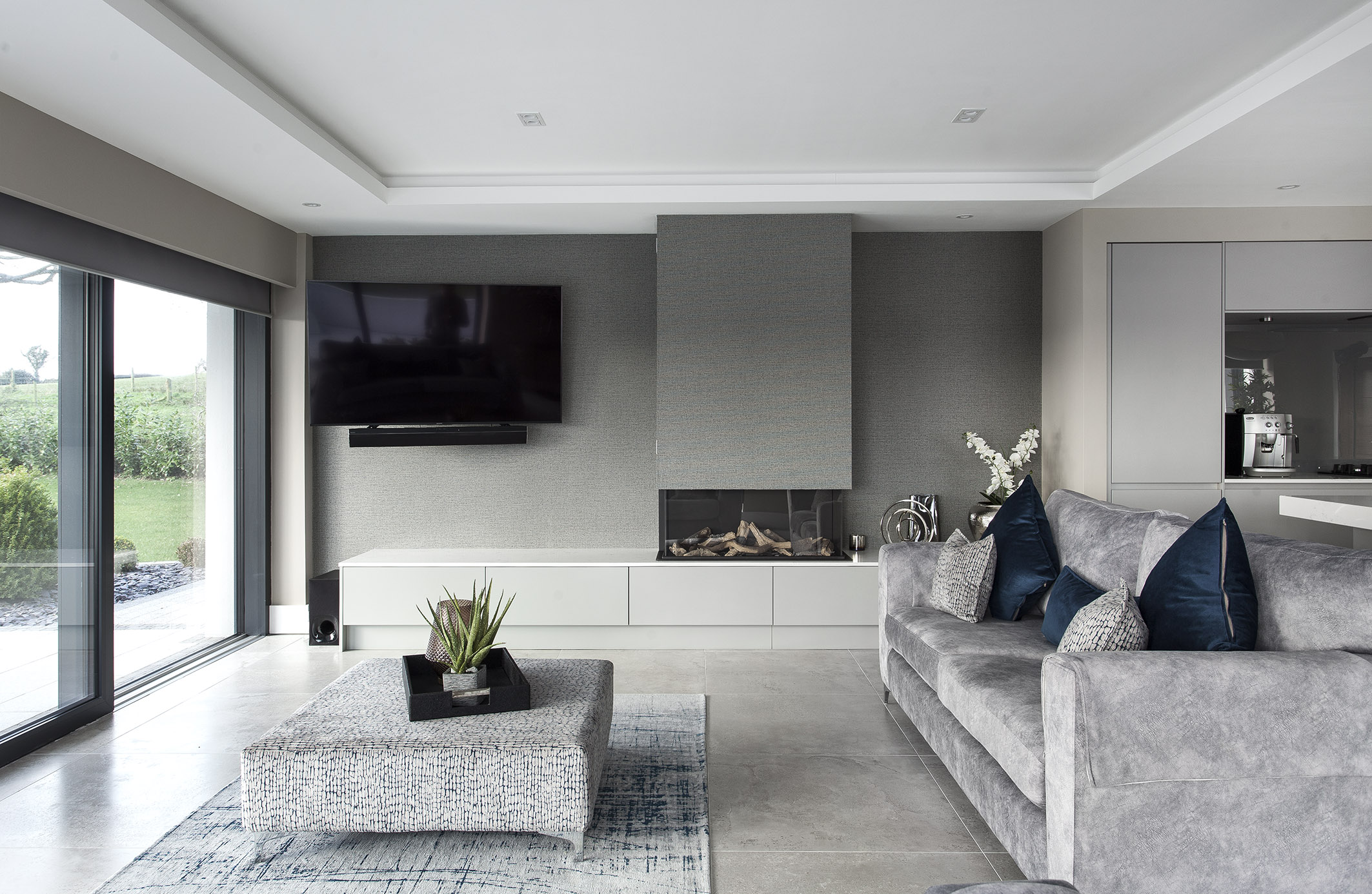 White hi gloss kitchen with coffee station and hidden utility