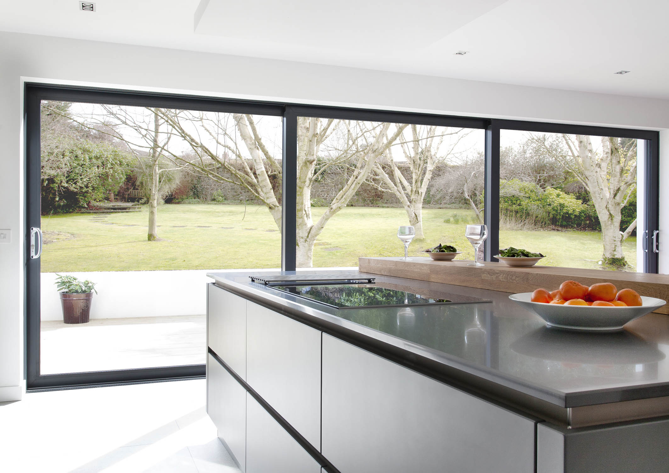 White hi gloss kitchen with coffee station and hidden utility