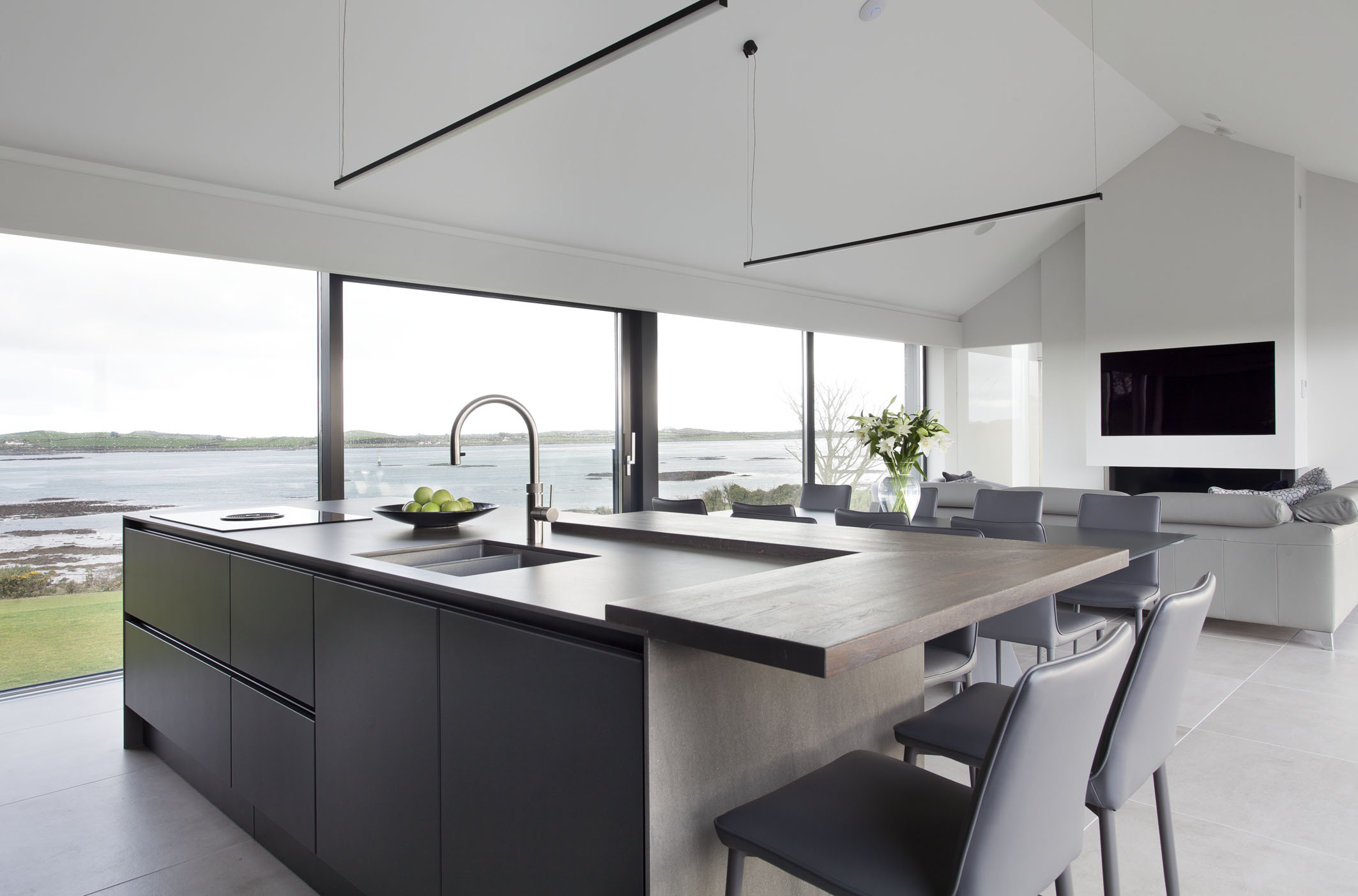 White hi gloss kitchen with coffee station and hidden utility