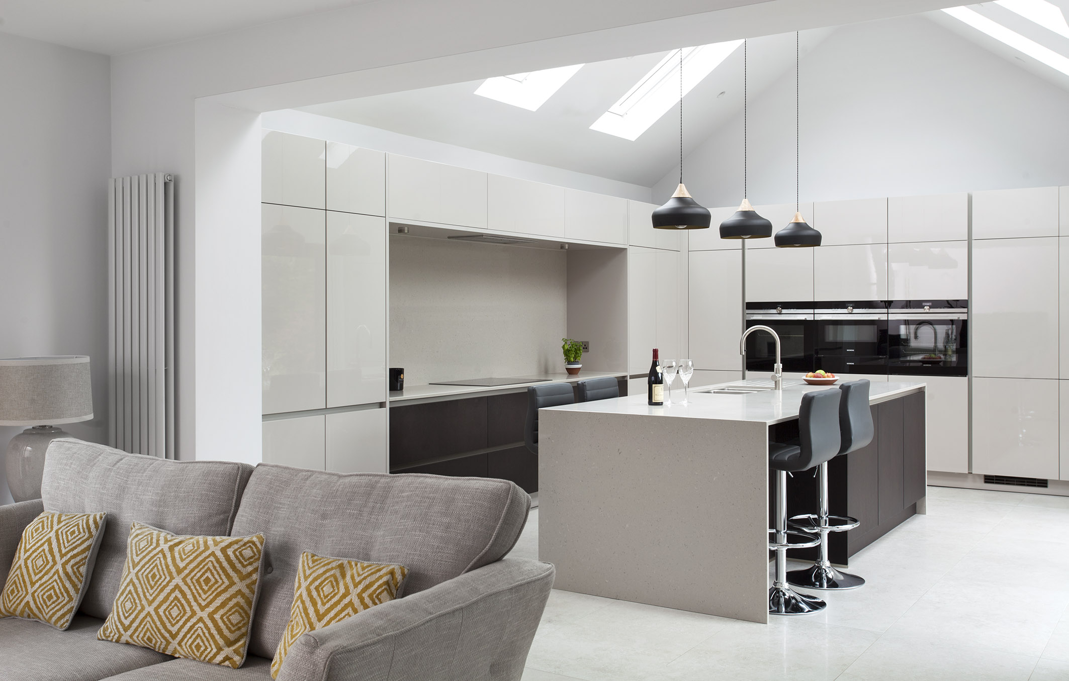 White hi gloss kitchen with coffee station and hidden utility