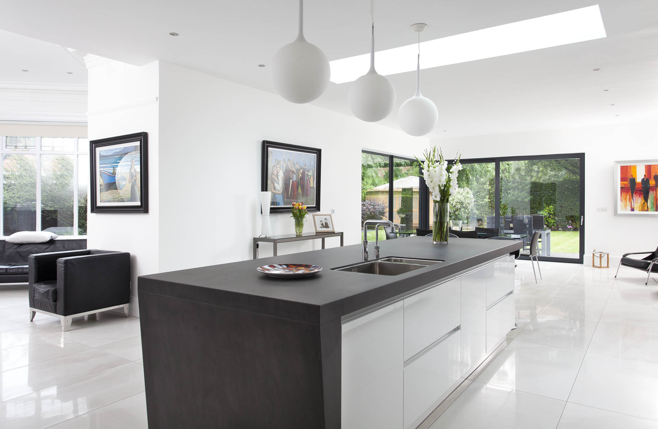 White hi gloss kitchen with coffee station and hidden utility