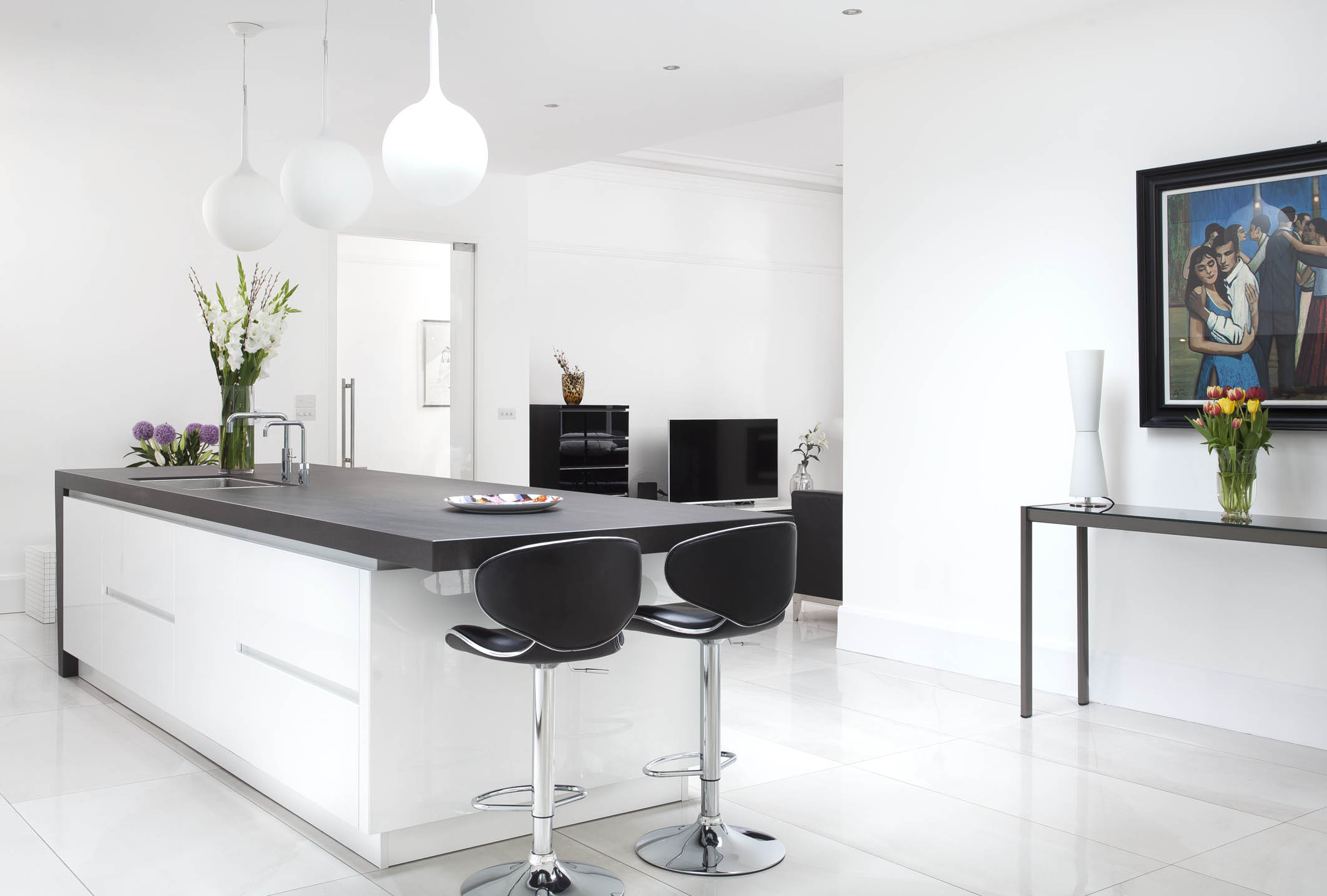 White hi gloss kitchen with coffee station and hidden utility