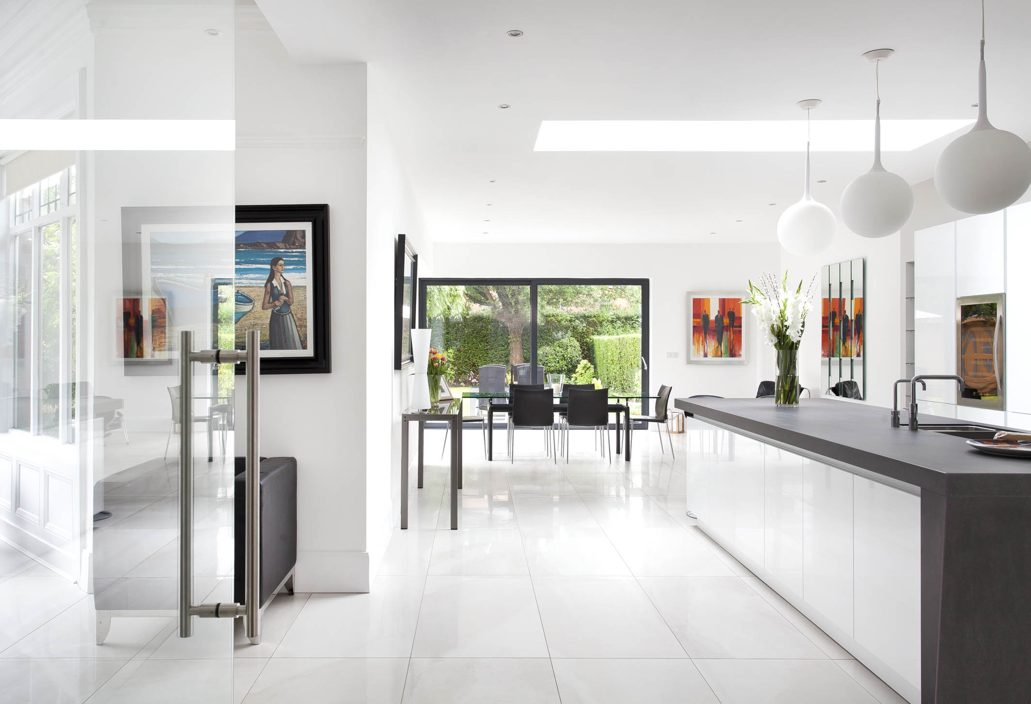 White hi gloss kitchen with coffee station and hidden utility